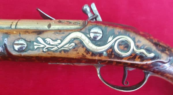 A good Flintlock brass barrelled Blunderbuss pistol by R Stringer dating from 1714. Ref 9532